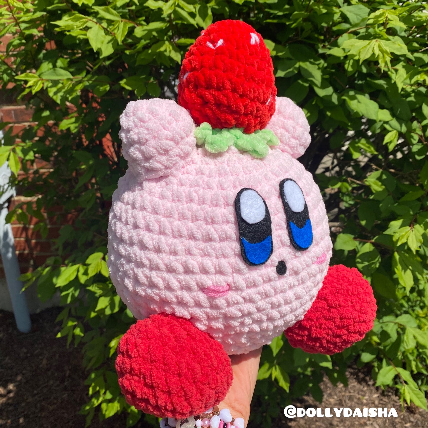 Pink Puff holding a strawberry plushie 12in