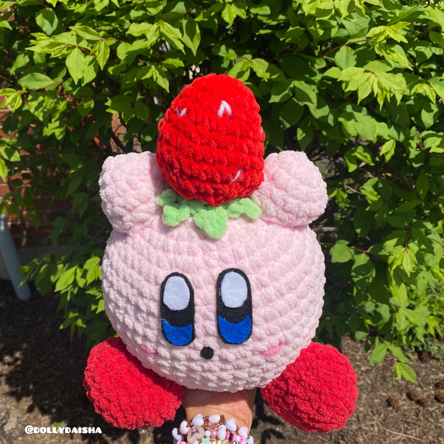 Pink Puff holding a strawberry plushie 12in