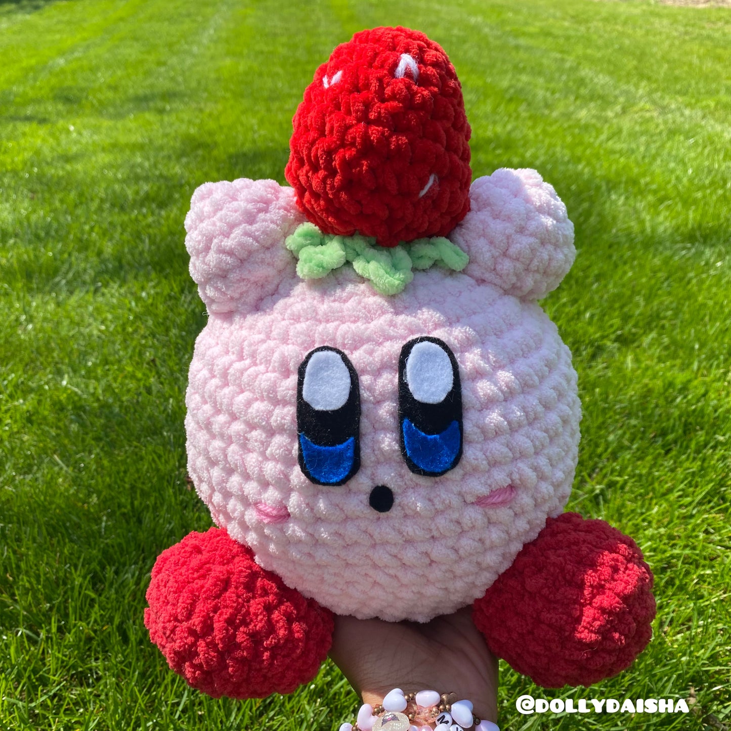 Pink Puff holding a strawberry plushie 12in